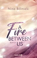 Buchcover von A Fire Between Us: Roman von Nina Bilinszki